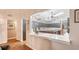 Bright kitchen view with a marble-top bar overlooking island, updated cabinetry, and modern lighting at 1525 Hinton St, Port Charlotte, FL 33952