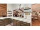 Charming kitchen features marble counters, wood accents, and a view into the living area with a fireplace at 1525 Hinton St, Port Charlotte, FL 33952
