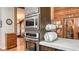 Close-up of a kitchen showcasing modern appliances, wooden accents, and unique design elements at 1525 Hinton St, Port Charlotte, FL 33952