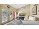 Cozy living room with wood floors, access to an outdoor patio and a comfortable white couch at 1525 Hinton St, Port Charlotte, FL 33952