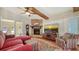 Comfortable living room with a brick fireplace and modern television at 1525 Hinton St, Port Charlotte, FL 33952