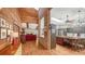 Open floorplan connects living, dining, and kitchen areas, highlighted by exposed brick and wood accents at 1525 Hinton St, Port Charlotte, FL 33952