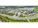 Aerial view of the community, golf course, and clubhouse, showing the many community features at 16000 Grassland Ln # 3116, Punta Gorda, FL 33982