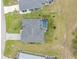 Aerial view of a home with its own private screened-in pool and patio, with lush greenery at 16265 Juarez Cir, Punta Gorda, FL 33955