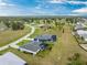 Beautiful aerial view of a neighborhood featuring many homes with screened in pools and landscaping at 16265 Juarez Cir, Punta Gorda, FL 33955