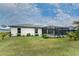 Spacious backyard featuring a screened-in pool area perfect for outdoor entertaining at 16265 Juarez Cir, Punta Gorda, FL 33955