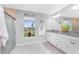 Well-lit bathroom showcasing granite counters, double sinks, modern fixtures, and a refreshing view at 16265 Juarez Cir, Punta Gorda, FL 33955