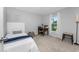 Comfortable bedroom featuring a cozy bed, a desk, and a window with a view at 16265 Juarez Cir, Punta Gorda, FL 33955