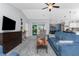 Open living room with modern furniture, ceiling fan and sliding glass doors to the lanai at 16265 Juarez Cir, Punta Gorda, FL 33955