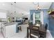 Open floor plan features a modern kitchen, dining area, and living room with plenty of natural light at 16265 Juarez Cir, Punta Gorda, FL 33955