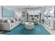 Inviting living room with comfortable seating, stylish decor, and ample natural light, creating a welcoming space at 16395 Larocha Dr, Punta Gorda, FL 33955