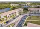 Bird's-eye view of condo building with parking, lawns and community at 175 Kings Hwy # 538, Punta Gorda, FL 33983