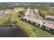 Scenic aerial view of condo community, highlighting well-maintained landscaping and ample parking at 175 Kings Hwy # 538, Punta Gorda, FL 33983