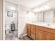 Bathroom features a wood vanity with drawers and a toilet and shower in a separate room at 175 Kings Hwy # 538, Punta Gorda, FL 33983