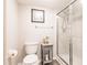 Cozy bathroom with a gray side table, new toilet, and modern glass shower enclosure at 175 Kings Hwy # 538, Punta Gorda, FL 33983