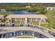 Aerial view of a condo community near a lake with ample parking spaces at 175 Kings Hwy # 538, Punta Gorda, FL 33983