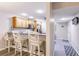 Eat-in kitchen featuring white bar stool seating and a bright, airy atmosphere at 175 Kings Hwy # 538, Punta Gorda, FL 33983