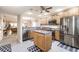 Bright kitchen with stainless steel appliances, wood cabinets, and a center island at 175 Kings Hwy # 538, Punta Gorda, FL 33983