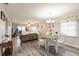 Open-concept living room with hardwood floors, a dining area, and bright natural light at 175 Kings Hwy # 538, Punta Gorda, FL 33983