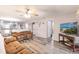 Inviting living room featuring comfortable seating and wood-look floors throughout at 175 Kings Hwy # 538, Punta Gorda, FL 33983
