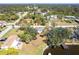 Aerial view showcasing the home's location, lush landscaping, waterfront access, and neighborhood layout providing a comprehensive view at 18379 Meyer Ave, Port Charlotte, FL 33948