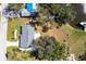 Aerial view showing the home’s proximity to the water, backyard landscaping, and the overall neighborhood layout at 18379 Meyer Ave, Port Charlotte, FL 33948