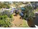 Aerial view of property showcasing well-maintained backyard, mature trees, and proximity to the water offering picturesque views at 18379 Meyer Ave, Port Charlotte, FL 33948
