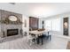 Charming dining room featuring a brick fireplace and modern chandelier at 18379 Meyer Ave, Port Charlotte, FL 33948