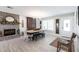 Elegant dining room featuring a cozy fireplace, hardwood floors, and stylish decor at 18379 Meyer Ave, Port Charlotte, FL 33948