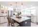 Beautiful kitchen featuring a large center island with seating, stainless appliances, and modern lighting at 18379 Meyer Ave, Port Charlotte, FL 33948