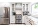 Stylish kitchen featuring stainless steel appliances, a gas range, and white shaker cabinets at 18379 Meyer Ave, Port Charlotte, FL 33948
