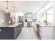 Modern kitchen with a large island, stainless steel appliances, and custom cabinetry at 18379 Meyer Ave, Port Charlotte, FL 33948