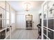 Bright room featuring a vintage piano and elegant lighting fixture at 18379 Meyer Ave, Port Charlotte, FL 33948
