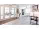 Inviting room showcasing white furnishings, a decorative rug, sliding glass doors, and light wood floors at 18379 Meyer Ave, Port Charlotte, FL 33948