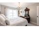 Sunlit main bedroom with chandelier and access to backyard at 18379 Meyer Ave, Port Charlotte, FL 33948