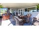 Covered patio with outdoor seating, fire pit, and view of the backyard at 18379 Meyer Ave, Port Charlotte, FL 33948