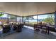 Spacious screened-in porch with waterfront views, ample seating, and a dining area, perfect for outdoor enjoyment at 18379 Meyer Ave, Port Charlotte, FL 33948