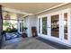 Inviting porch area featuring a turtle rug and view through the glass doors to the exterior at 18379 Meyer Ave, Port Charlotte, FL 33948
