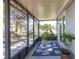 Relaxing screened-in porch with comfortable seating, views of the garden, and an inviting atmosphere at 18379 Meyer Ave, Port Charlotte, FL 33948