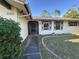 View of the front of the house, including the front door and the address numbers at 20262 Hamilton Ave, Port Charlotte, FL 33952