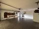 Spacious garage with storage, laundry, workbench, door hardware, and overhead storage at 20262 Hamilton Ave, Port Charlotte, FL 33952