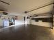Spacious garage with laundry, water heater, storage cabinets, and overhead door hardware at 20262 Hamilton Ave, Port Charlotte, FL 33952