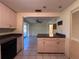 Living area that features an attached breakfast bar, sliding doors to the patio, and kitchen access at 20262 Hamilton Ave, Port Charlotte, FL 33952
