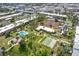An aerial view of the community's tennis courts, swimming pool, shuffleboard, and common areas at 21287 Gertrude Ave # 106, Port Charlotte, FL 33952