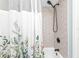 Corner view of the shower and tub area with a shower curtain at 21287 Gertrude Ave # 106, Port Charlotte, FL 33952