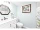 Bathroom featuring patterned shower curtain, vanity sink and hexagon mirror at 21287 Gertrude Ave # 106, Port Charlotte, FL 33952