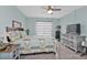 This bedroom features tiled floors, a ceiling fan, and a pleasant atmosphere at 21287 Gertrude Ave # 106, Port Charlotte, FL 33952