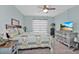 Cozy bedroom features stylish decor and a window at 21287 Gertrude Ave # 106, Port Charlotte, FL 33952