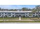 Well-maintained condo building with mature landscaping, offering a welcoming and peaceful environment at 21287 Gertrude Ave # 106, Port Charlotte, FL 33952