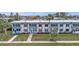 Exterior view of a well-maintained condominium with landscaping and convenient parking at 21287 Gertrude Ave # 106, Port Charlotte, FL 33952
